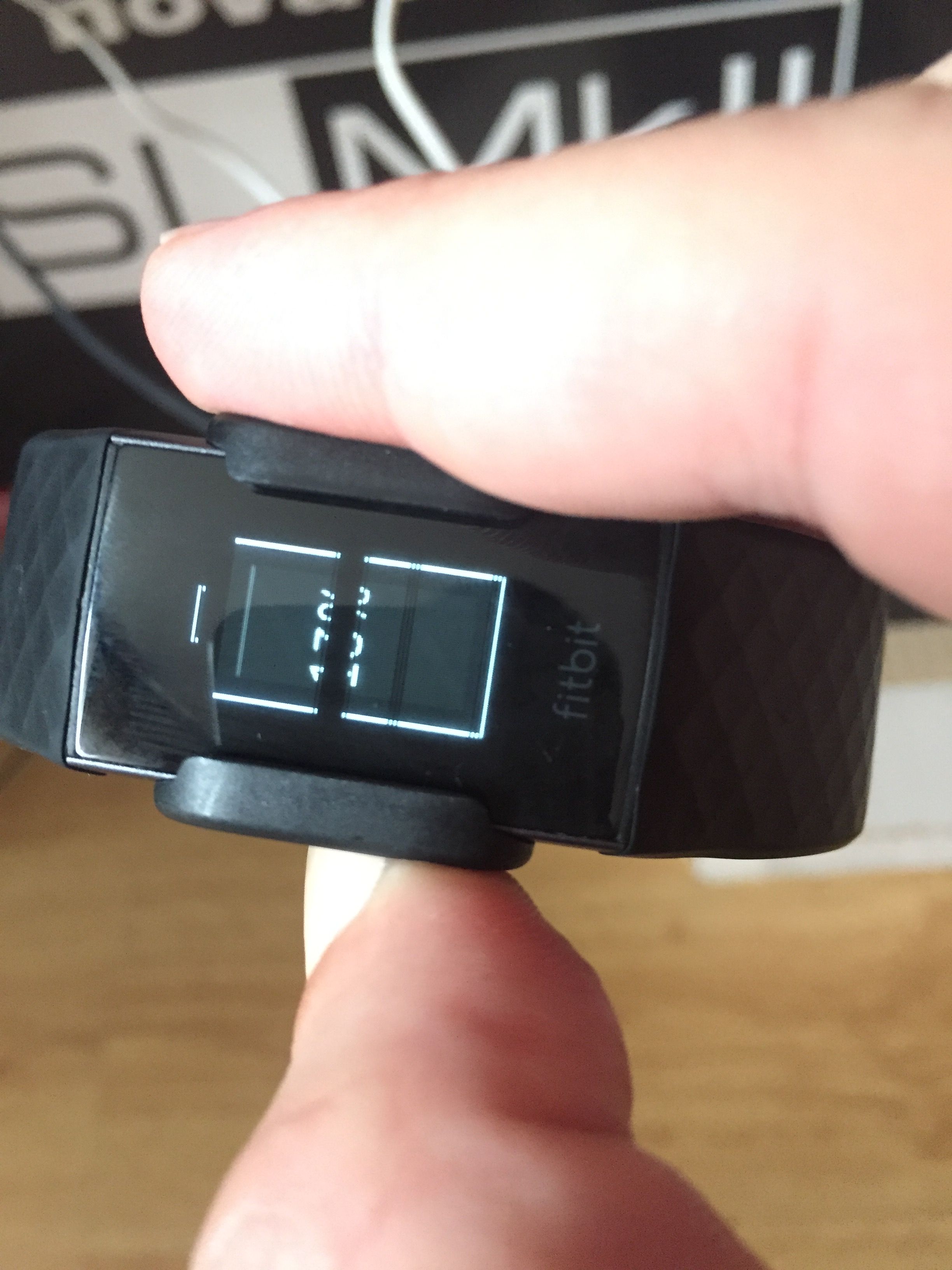 fitbit charge 3 has black lines on screen