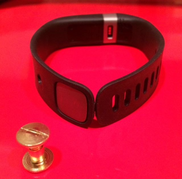 With the binder fastener screw and hole punched-out on the band