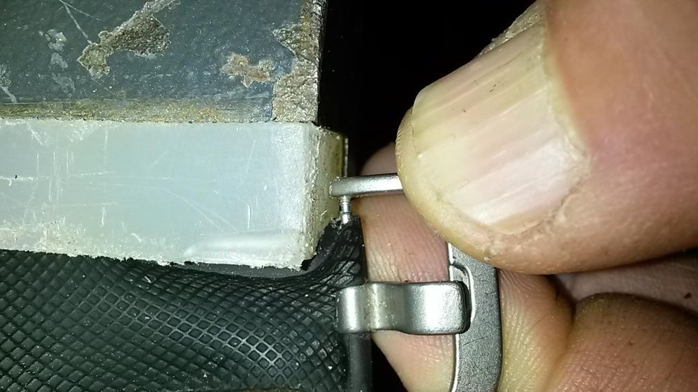 strap compressed in a vise for visibility