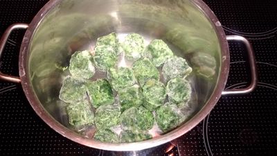 frozen spinach in saucepan