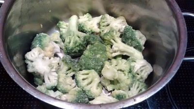 frozen broccoli in saucepan