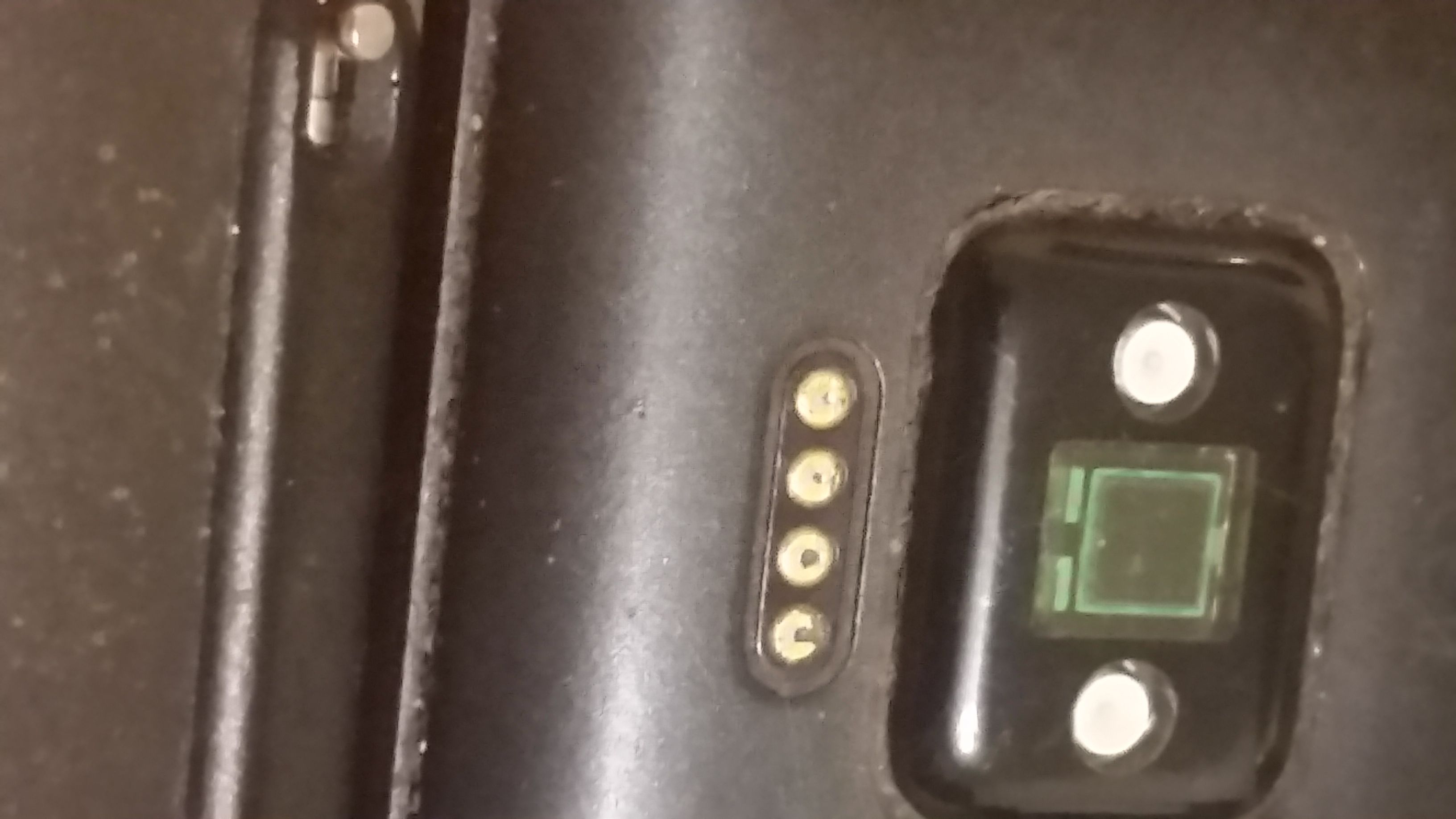 Found holes in the charging terminals on the back Fitbit