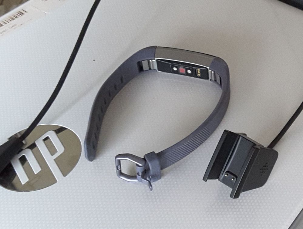Back of tracker and inside of charger clip
