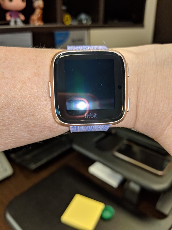 Fitbit versa cheap on woman's wrist