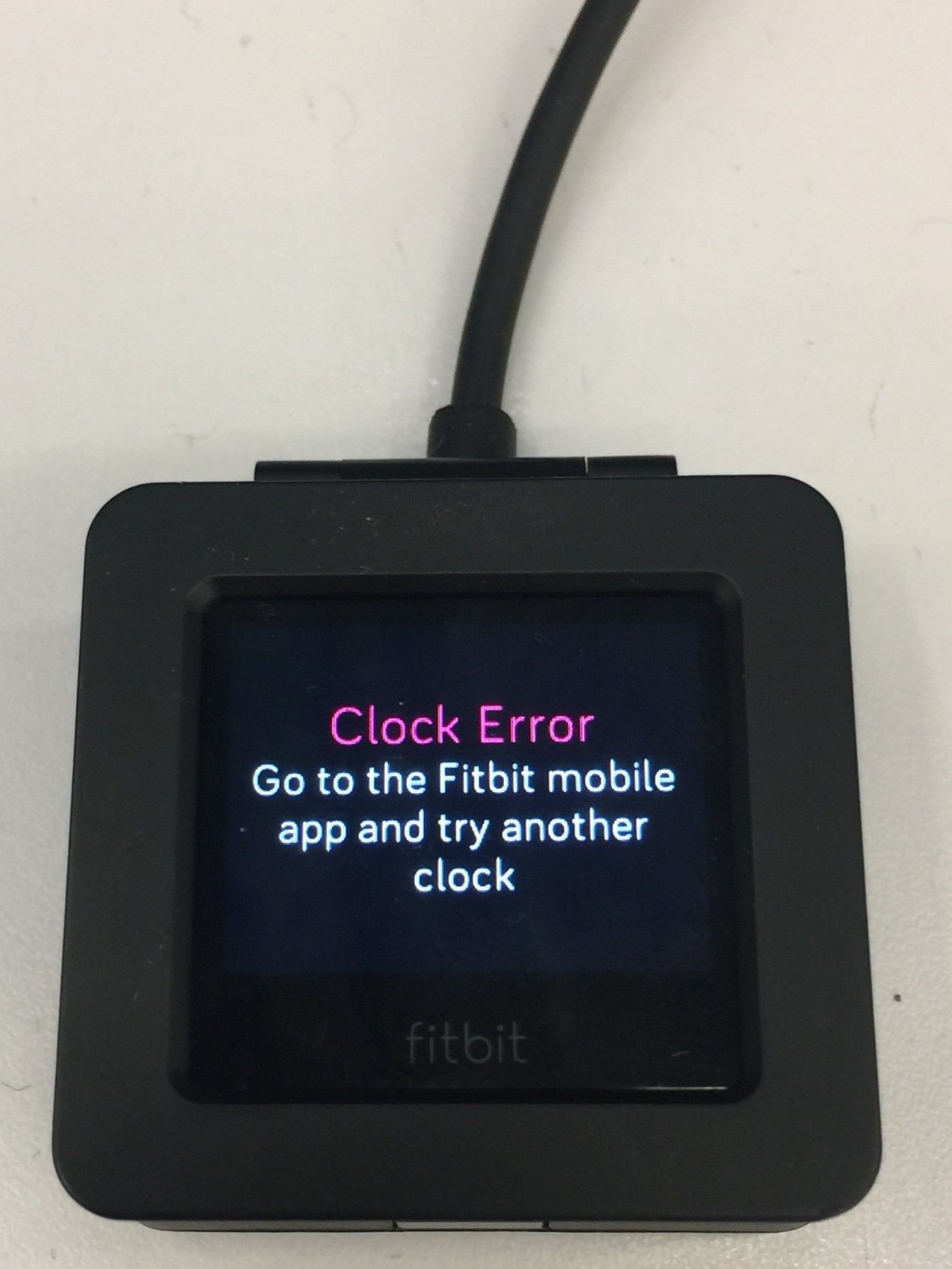 how to reset fitbit clock