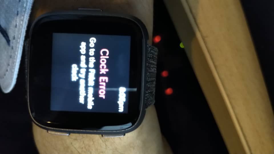 how to reset the clock on my fitbit versa