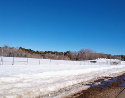 The baseball field near the trail, covered in snow.