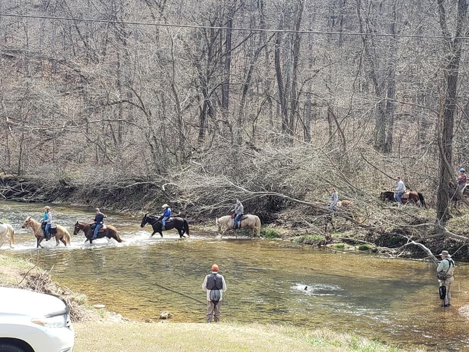 See the man catching a trout?