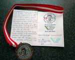 My well earned medal and little impression written in my walking diary